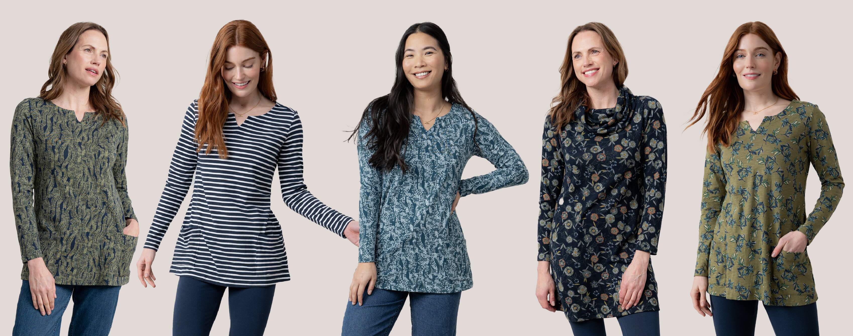 Five women wearing patterned long-sleeve tunics on a plain background